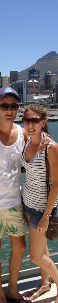 Young couple posing for a photo on the deck of a cruise ship in Cape Town